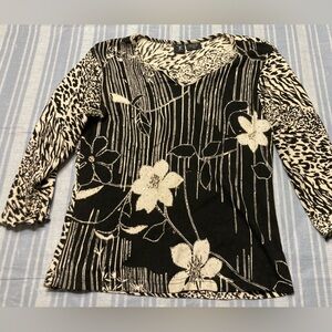 Zushi black and off-white floral top with clear beading throughout.
